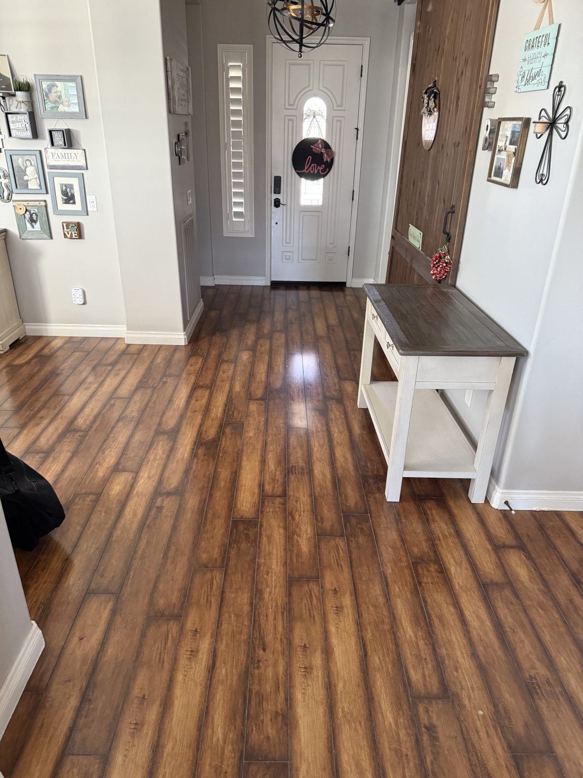 Entryway before — dated, worn flooring