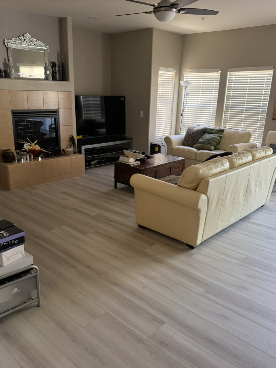 Living room after — new luxury vinyl flooring